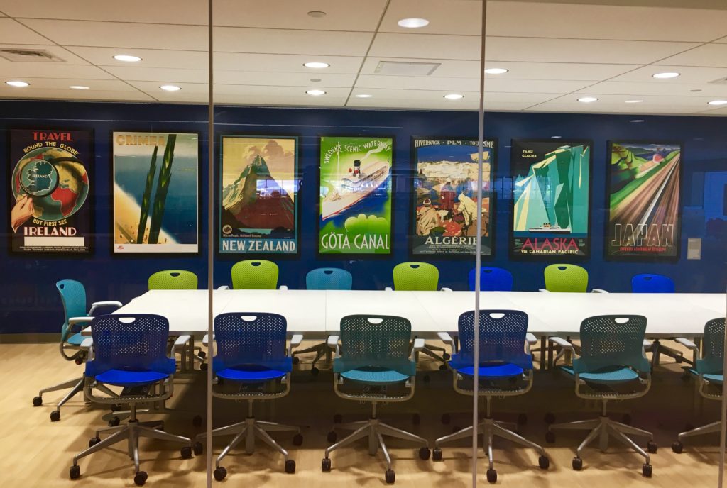 Conference room with travel posters.